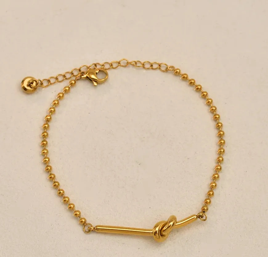PULSERA NUDO GOLD